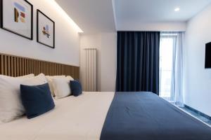 Postel nebo postele na pokoji v ubytování Hotel Vigo