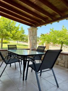 a black table and chairs on a patio at Kappa Domus in Siviri