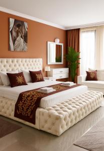 A bed or beds in a room at Парк Апарт-Хотел Виктория 1