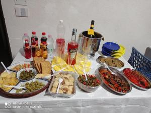 a table with many different types of food and drinks at Garden Gafè in Diamante +4 photos