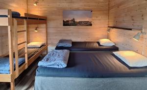 Postel nebo postele na pokoji v ubytování Piilijärvi Camping