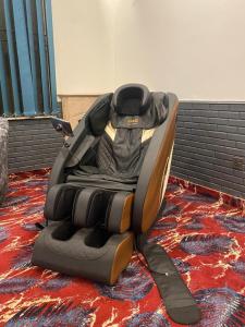a car seat sitting on top of a carpet at La Maison Islamabad in Islamabad +22 photos