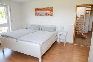 Katil atau katil-katil dalam bilik di Ferienwohnung Rhader Wiesen
