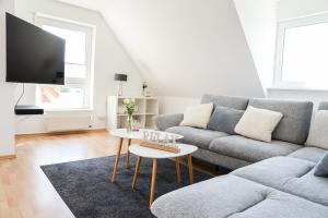 Ruang duduk di Ferienwohnung Rhader Wiesen