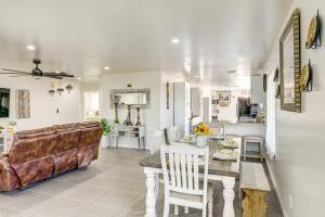 a living room with a couch and a table at 1 Mi to Rabobank Arena Home with Gazebo! in Bakersfield