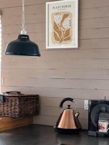 a tea kettle on a counter in a kitchen at 43 Harbour View in Poole +22 photos