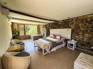 Voodi või voodid majutusasutuse Tunas & Cabras Hotel toas