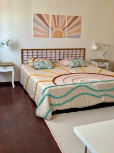 a bedroom with two beds and a table at Ocean House in Ferrel