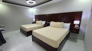 Postel nebo postele na pokoji v ubytování Hotel New York