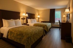 Postel nebo postele na pokoji v ubytování Econo Lodge Inn & Suites Fairview Heights St Louis + 20 fotografií