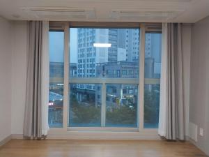 a large window with a view of a city at Giheung Station Lotte Castle in Yongin