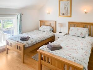 Voodi või voodid majutusasutuse Fawnlea Cottage toas