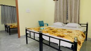 Letto o letti in una camera di Mysuru-hotel