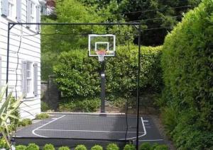 a basketball hoop with a net on a court at Firepit, Beach, Basketball, LuxuryVilla in Palmetto Bay +63 photos