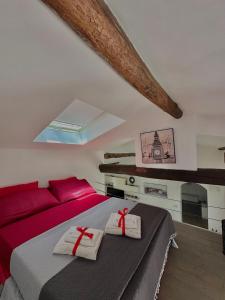 a bedroom with a bed with red pillows on it at Ca' del Grillo in La Spezia
