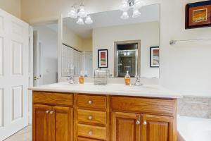 a bathroom with a sink and a mirror at Reserve 03-D in Sugar Mountain +14 photos