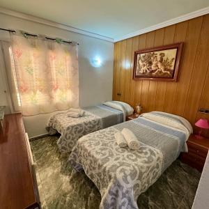Postel nebo postele na pokoji v ubytování Apartamento Zodiac AB 6D