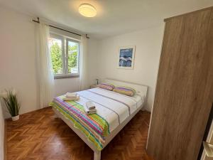 Postel nebo postele na pokoji v ubytování Apartments Meri