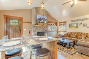 a living room with a couch and a fireplace at Whiskey Springs Cabin in West Yellowstone