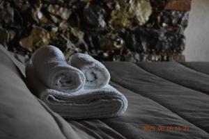 a towel sitting on top of a bed at Rabat home in Tursi +60 photos