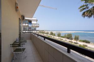 a balcony of a building with a view of the ocean at Dimora Waterfront in Bari