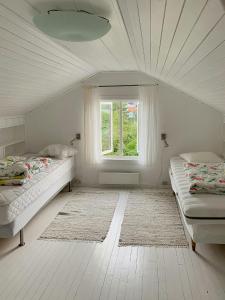 Ένα ή περισσότερα κρεβάτια σε δωμάτιο στο Idyllic Cabin With Sea View On Peaceful Island +20 φωτογραφίες