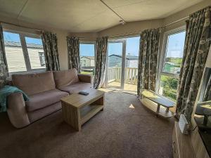 A seating area at Stunning 8 Berth Caravan With Decking And Unlimited Wi-Fi, Ref 71012P