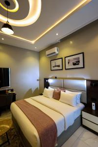 Rúm í herbergi á Ringruby Hotel, Eso Close