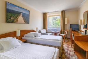 Кровать или кровати в номере Hotel Bartan Gdansk Seaside +37 фотографий