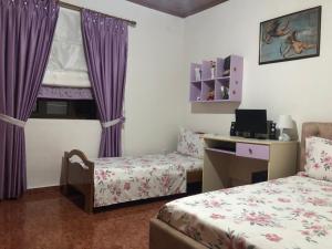 Postel nebo postele na pokoji v ubytování Dirala Guest House