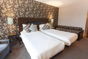Katil atau katil-katil dalam bilik di The Twelve Hotel