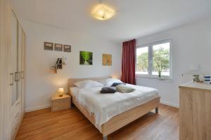 Postel nebo postele na pokoji v ubytování Ferienwohnung Meeresblick