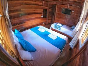 Postel nebo postele na pokoji v ubytování Hotel Delfín Real