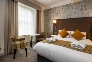 Postel nebo postele na pokoji v ubytování New Town Hotel