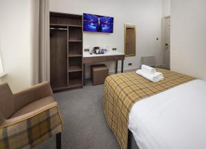 Postel nebo postele na pokoji v ubytování New Town Hotel