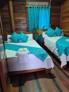 Postel nebo postele na pokoji v ubytování Hotel Delfín Real