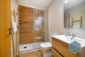 a bathroom with a shower with a toilet and a sink at Lagar da Vila - Dream Lodging in Avelar +6 photos