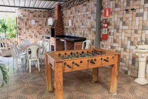 a wooden table with a chess board on top of it at Hotel Serra Negra in Betim +55 photos