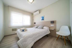 Postel nebo postele na pokoji v ubytování Apartaments Lamoga - Boabi