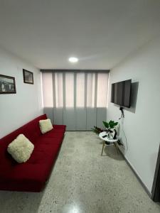 TV a/nebo společenská místnost v ubytování Apartamento Cerca Al Malecón Del Rio