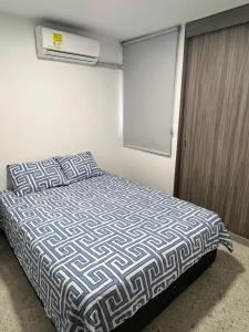 Postel nebo postele na pokoji v ubytování Apartamento Cerca Al Malecón Del Rio