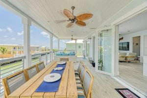 a dining room with a table and chairs at Casa Playa- Luxury Pool Home, 36' Dock in Marathon
