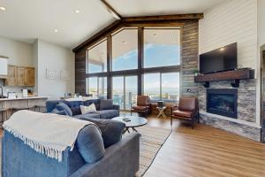 a living room with a couch and a fireplace at The Big Blue in Garden City