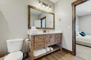 a bathroom with a sink and a mirror at The Big Blue in Garden City +18 photos