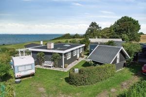 an aerial view of a house and a caravan at Summer House With 180 Degree Sea View On Langeland in Tranekær