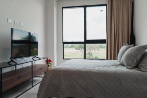 Ένα ή περισσότερα κρεβάτια σε δωμάτιο στο Cocora Real