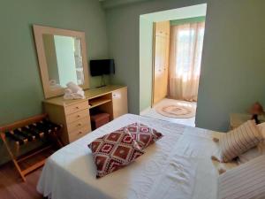 Postel nebo postele na pokoji v ubytování Galini Hotel Agios Ioannis Pelion