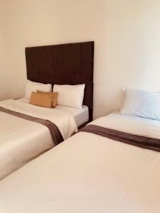 Postel nebo postele na pokoji v ubytování khayelihle guest house