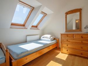 Łóżko lub łóżka w pokoju w obiekcie Holiday Home Mały dworek by Interhome