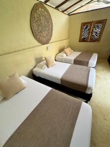 Ένα ή περισσότερα κρεβάτια σε δωμάτιο στο MAKAI BEACH HOSTEL